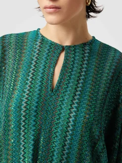 Blouse à manches longues en zigzag avec paillettes et franges