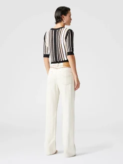 Cinq poches en jean avec empiècements grecs en zigzag