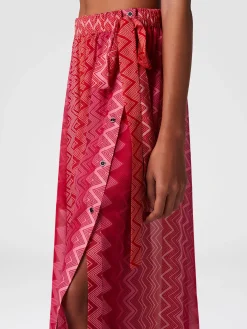 Jupe longue recouverte en soie imprimée avec fermeture sur le devant