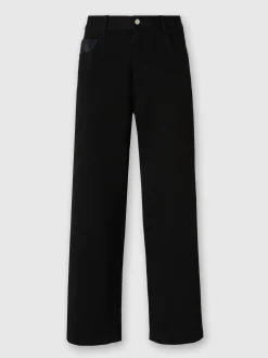 Pantalon cargo en denim avec empiècements en tricot à chevrons