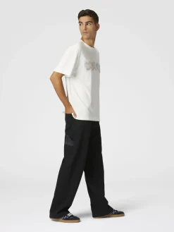 Pantalon cargo en denim avec empiècements en tricot à chevrons