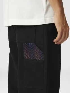 Pantalon cargo en denim avec empiècements en tricot à chevrons