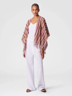 Poncho en maille avec motif chevron et franges