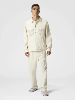 Veste en jean avec empiècements en tricot à chevrons